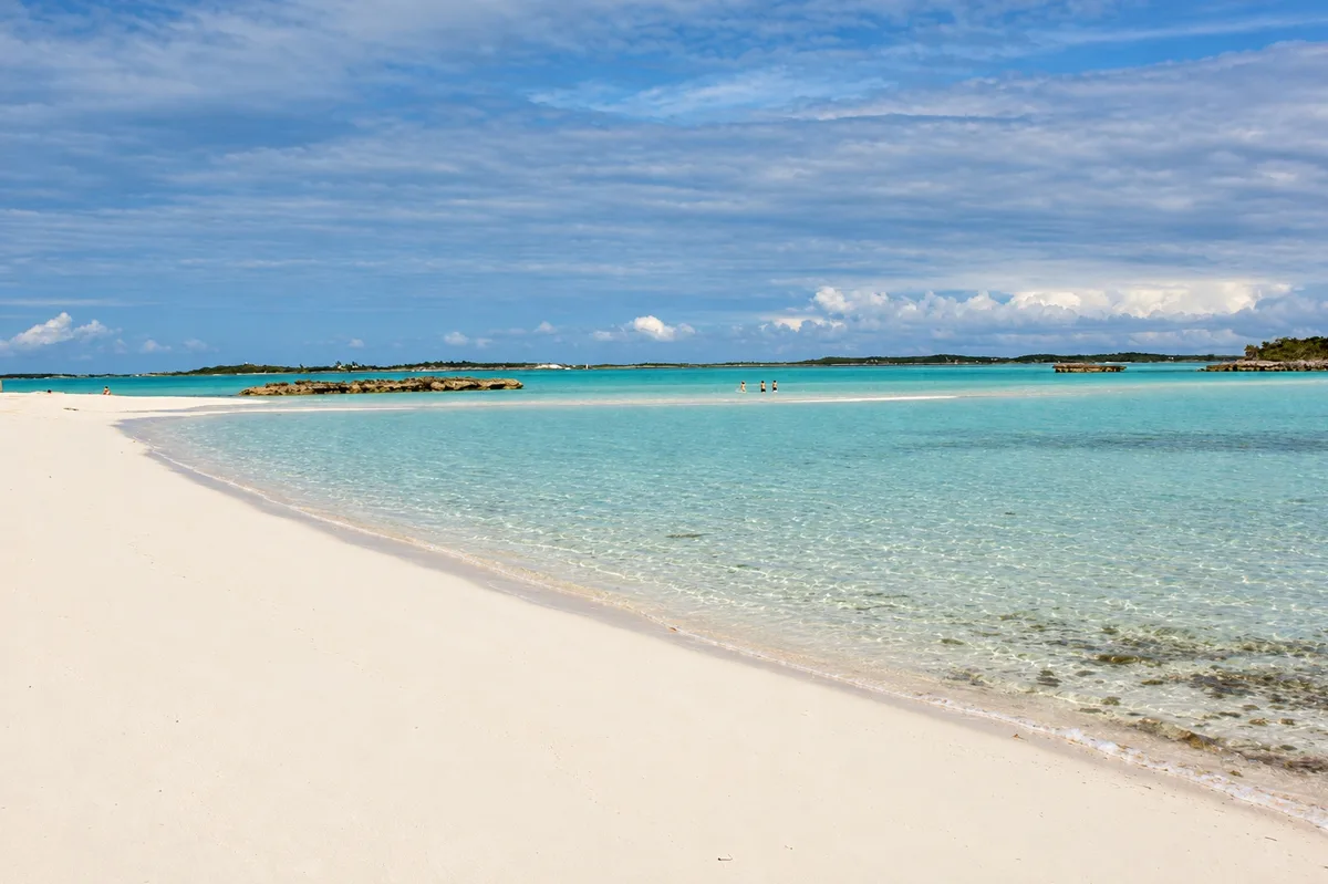 White sand beach with clear turquoise shallows on Staniel Cay