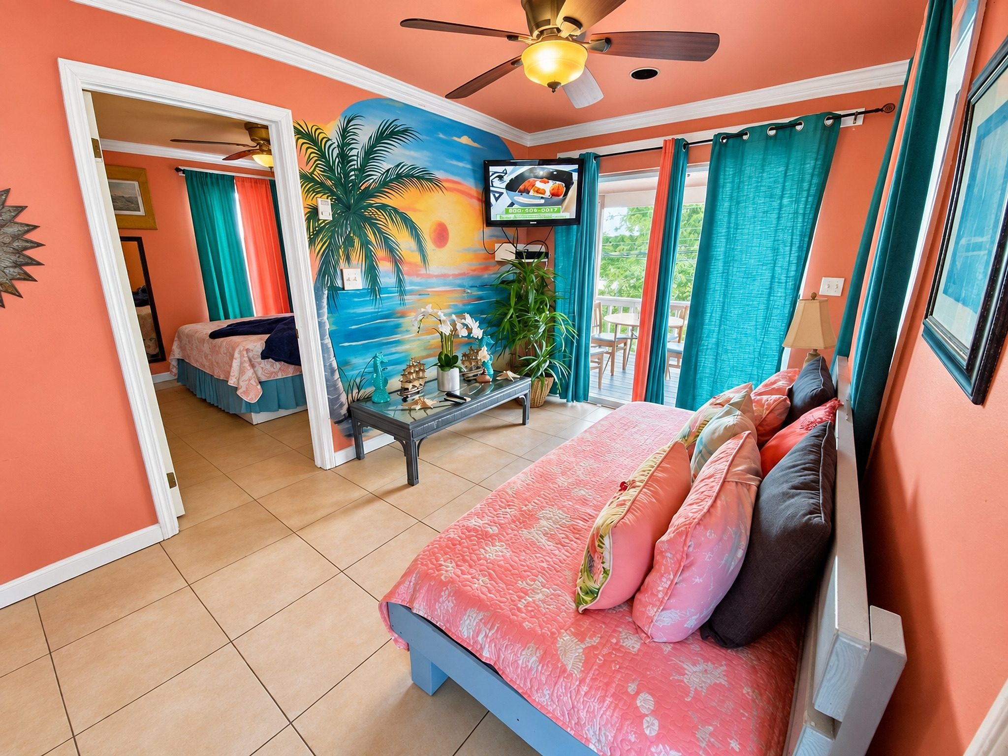 Sunset Beach bedroom with a mounted television and a long hallway view beyond