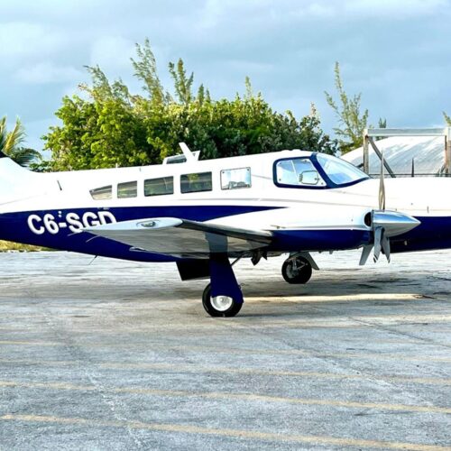 Twin engine charter plane parked on the Staniel Cay airstrip