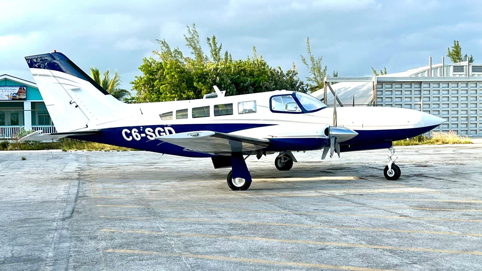 Twin engine charter plane parked on the Staniel Cay airstrip