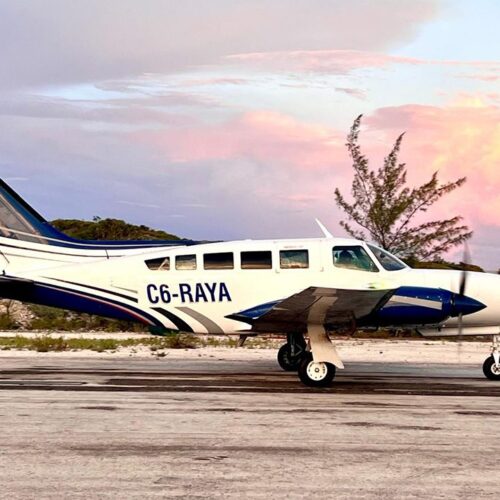 Charter plane on the airstrip at sunset