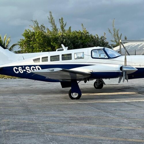 Twin engine charter plane parked on the airstrip